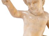 statue of a child with a raised hand on a white background