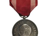 une image représentant une médaille entourée d'un ruban rouge