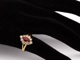 an image of a close up of a person ' s hand with a ring on it
