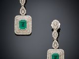 a pair of emerald and diamond earrings