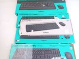 three boxes of computer keyboards sitting on top of a white table