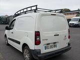 a white van that is parked in a parking lot