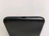 the back view of a black iphone with the camera facing up