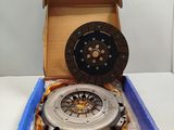 an open box with a clutch on top of it sitting on a table