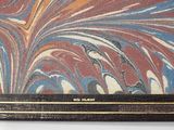 painting of a red, blue, and white marbled surface with a gold border