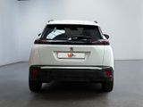 the rear end of a white suv parked in a white room