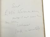 an open book with a handwritten note on the inside of it