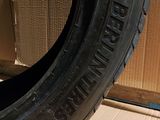 the tire of a car is sitting on a cardboard box