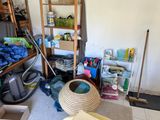 an image of a cluttered room with a lot of stuff on the floor