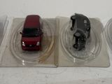 three toy cars that are sitting on top of each other