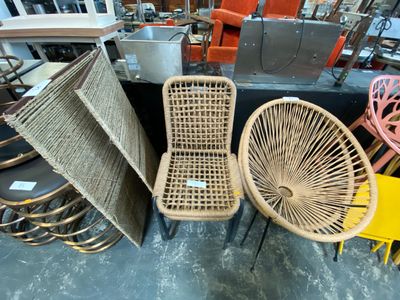 many different chairs and tables in a room