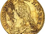 gros plan d'une pièce d'or avec un visage de femme