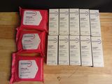 a group of six packets of soap sitting on top of a wooden table