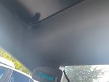 the view from inside of a car of a car with a clock on the dashboard