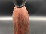 an image of a clay figurine of a woman