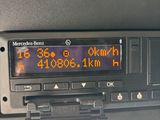 a radio in the dash of a car that is displaying the time