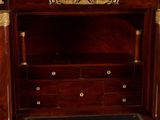 a wooden cabinet with a clock on top of it