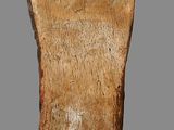 a close up of a piece of wood with a sticker on it