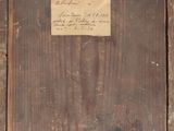 une vieille photo représentant un morceau de bois sur lequel est posé un bout de papier