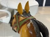 a statue of a horse with a bridle on it ' s head