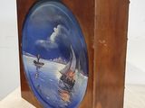 a wooden box with a picture of a boat on it