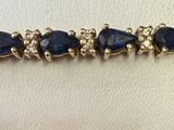 bracelet with black stones on a gold chain