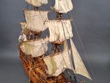 a model of a sailing ship on display on a table