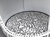 a black and white picture of a chair with a drawing on it