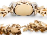 an image of a gold bracelet and bracelet with spikes on it