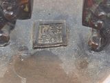 a close up of a metal object with a design on it