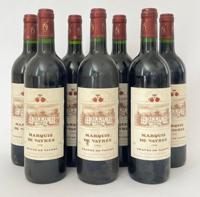 six bouteilles de vin rouge sont alignées sur une surface blanche
