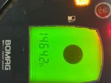 a close up of a digital meter with a green screen