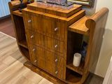 a wooden cabinet with a clock on top of it