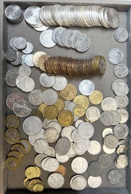 a shadow box filled with coins and a roll of coins