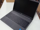 laptop on a white table with a brown box in the background