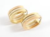 pair of gold toned rings on a white background