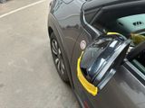 a close up of a car ' s side mirror on the side of the road