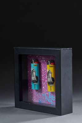 a picture of a picture of a pair of bells in a shadow box