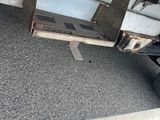 a close up view of a flatbed truck with a flat bed