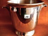 a silver cup that is sitting on a table