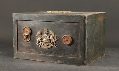 a small metal box with a coat of arms on it
