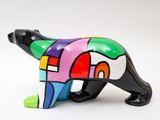 brightly colored ceramic sculpture of a polar bear on a white background