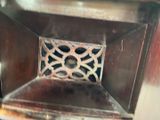 an old stove with a metal grate in it