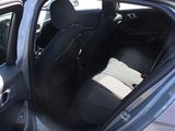 a car with the door open and the seats down