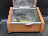 a glass container with a fish inside of it