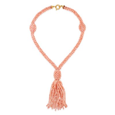 a pink beaded necklace with a tassel on a white background