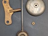 a clock that has a key and a lock on it