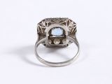 a close up of a ring with a stone in it