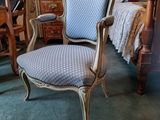 a chair that is sitting in the middle of a room