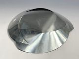 a close up of a metal object on a white surface